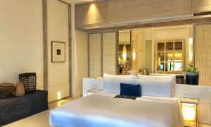 Luxury bedroom interior with rich furniture and scenic view from walkout deck. Luxury bedroom interior with rich furniture and scenic view from walkout deck