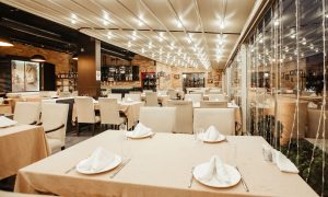 restaurant hall with lots of table restaurant hall with lots of table